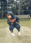 Richard Cole as toddler on swing